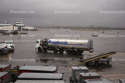 Allied Aviation fueling truck, LaGuardia Airport (LGA), Ground Equipment, belt loader, carts, rain, rainy, inclement weather, precipitation