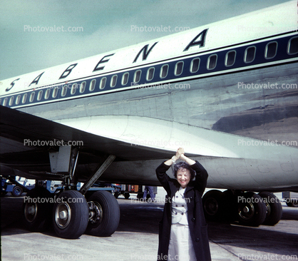 happy lady, coat, tires, wing, 1950s