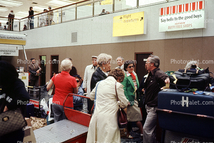 Customs, crowds, crowded, passengers, interior, inside terminal, baggage check-in, London, England, 1970s