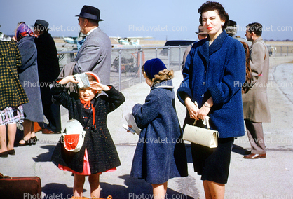 Waiting for Airplane, Woman, purse, formal, coat, caps, daughters, 1950s