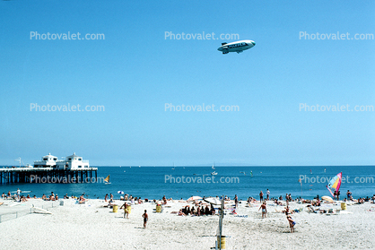 Malibu Beach, Volleyball, sun worshipers, crowds, people, shoreline, Airship Industries Skyship 500, G-SKSB Blimp, Pacific Ocean