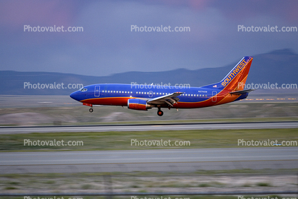 N374SW, Boeing 737-3H4, Southwest Airlines SWA, Baggage Carts, 737-300 series, landing