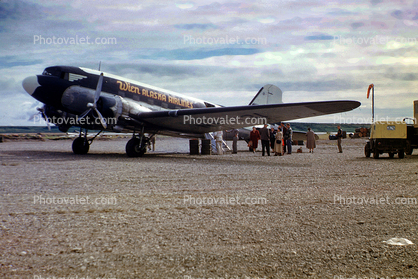 N57131, Douglas C-47A-65-DL, Wien Alaska Airlines, Passengers boarding, Kotzebue, Alaska, 1952, 1950s, milestone of flight