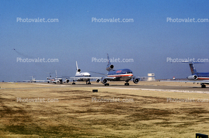 Jets lined up for take-off, American Airlines AAL, Douglas DC-10