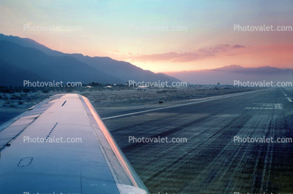 Lone Wing in Flight, Runway, mountains, Palm Sprints Airport