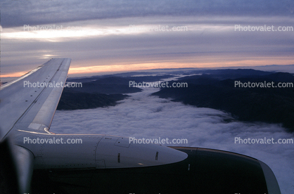 Lone Wing in Flight, Fog, valleys, jet engine, CFM56, flying, airborne
