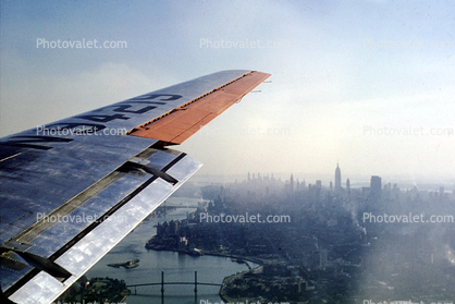 N94219, New York City, lone Wing in Flight, Manhattan, 1950s