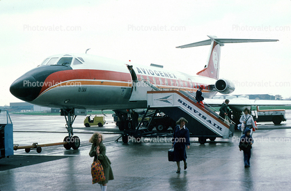 YU-AHS, Aviogenex, Tupolev Tu-134A, AHX, disembarking passengers, rain, Manchester Airport, May 1977