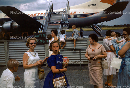 N476A, Martin 404, Mother, Daughter, smiles, Passengers waiting to board flight, 1950s