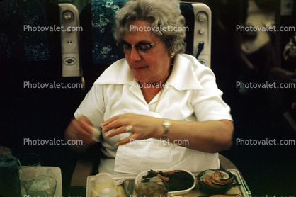 Woman Eating Airplane Food, Passenger