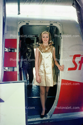 "Paper Uniforms" for the "Foreign Accent Service", Hostess, golden dress, Stewardess, Flight Attendant, Cabin Crew, Convair StarStream CV-880, 880, 1968, 1960s