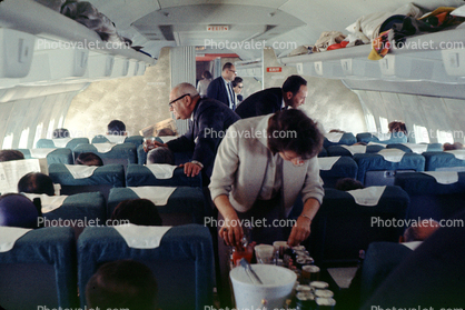 Stewardess, Boeing 707 interior, flight to SFO, men, women, July 1964, 1960s