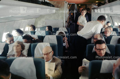 Boeing 707 interior, flight to SFO, men, women, July 1964, 1960s
