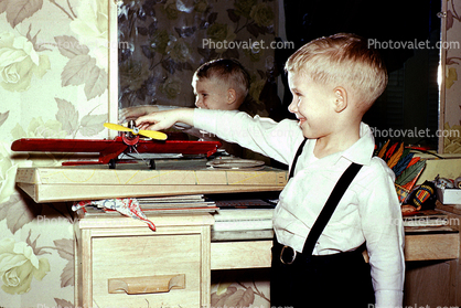 Boy with his Model Airplane, smiles, 1950s