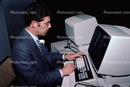 Four-Phase Systems Computer, Hand on Keyboard, Man at Computer, April 1982