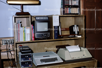 Apple IIC Computer, Printer, Monitor, floppy drive, tape back up, books, desk, desktop computer, 1970s