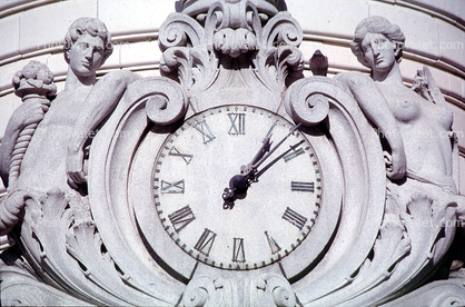 Clock, outside, exterior, building, bas-relief sculpture, man, woman, roman numerals