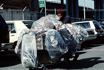 crosswalk, Homeless woman with a cart full of recyclable waste