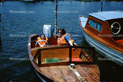 Mother with Daughter wearing lifevests, powerboat, cute, 1950s