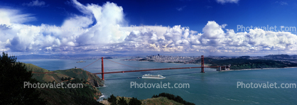 Cruise Ship passes under the Golden Gate Bridge, clouds