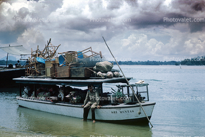 Overloaded boat, Sri Mentas, near Lanjut, 1950s