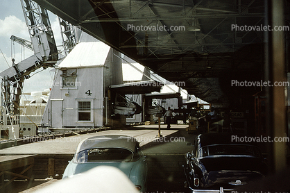 Dock, cranes, cars, 1950s