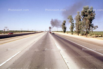 Station Wagon on Fire, smoke, highway