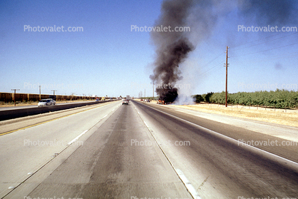 Station Wagon on Fire, smoke, highway