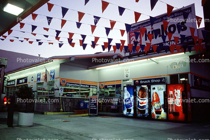 Soft Drink Machines, Flags, Building, Gas Station