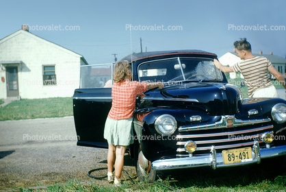 Ford Sedan, cabriolet, convertible, chrome grill, headlamps, girl, man, 1950s