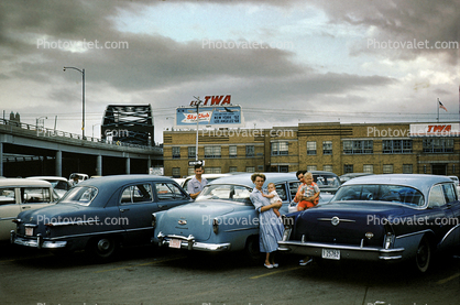 Buick, Chevy, Ford, TWA Billboard, Parked Cars, Women, babies, Car, Automobile, 1950s