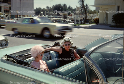 Ladies sitting in a Convertible Chevy, March 1963, 1960s