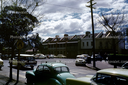 Cars, buildings, 1950s