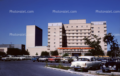 Hospital Parking Lot, building, cars, 1950s