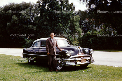 Man with his Pontiac Car, 4-door, Sedan, 1950s