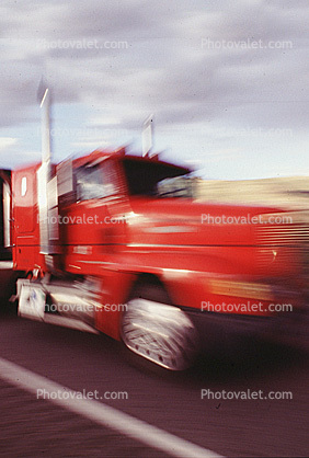streaking truck, flatbed trailer, motion blur