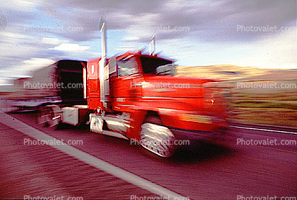 streaking truck, flatbed trailer, motion blur