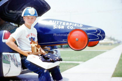 Butterfield Sign Comapany, Boy with Trophy, racer, 1950s