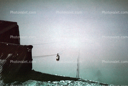 Cablecar coming up out of the fog from Des Aigulles 2300 meters, Chamonix, 1950s