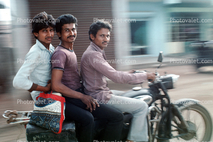 Three men on a motorcycle, riding, ride, smiles