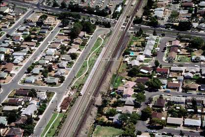BART tracks from the air, suburban landscape, homes, houses, buildings, streets, texture