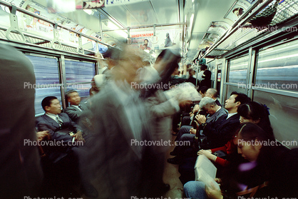 Crowded Train, passengers going home, suits, men, women, interior, inside