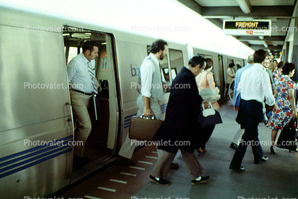 Passengers exiting a BART train, Commuters, Bay Area Rapid Transit, disembarking, people, 1980s