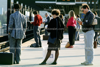 Passengers waiting for BART, station platform, commuters