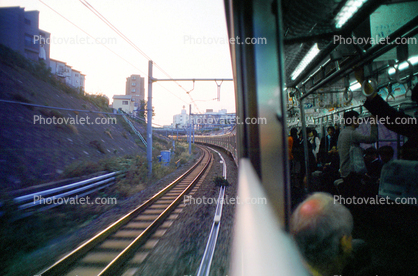Curved Track, curve, Inside outside, railcar, commuters, reading newspaper, interior, exterior
