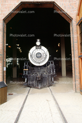 Steam Power locomotive head-on in a garage