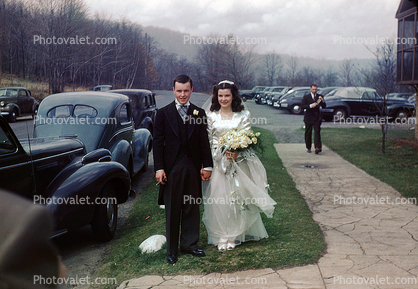 Bride and Groom, cars, cracked sidewalk, 1940s