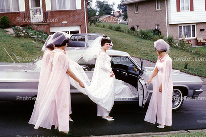 Bride getting inside a car, 1960s