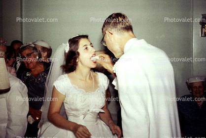 Bride and Groom eating cake, 1950s