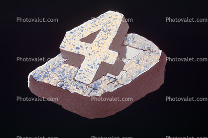 Number Four, title, embedded in Rock, Granite